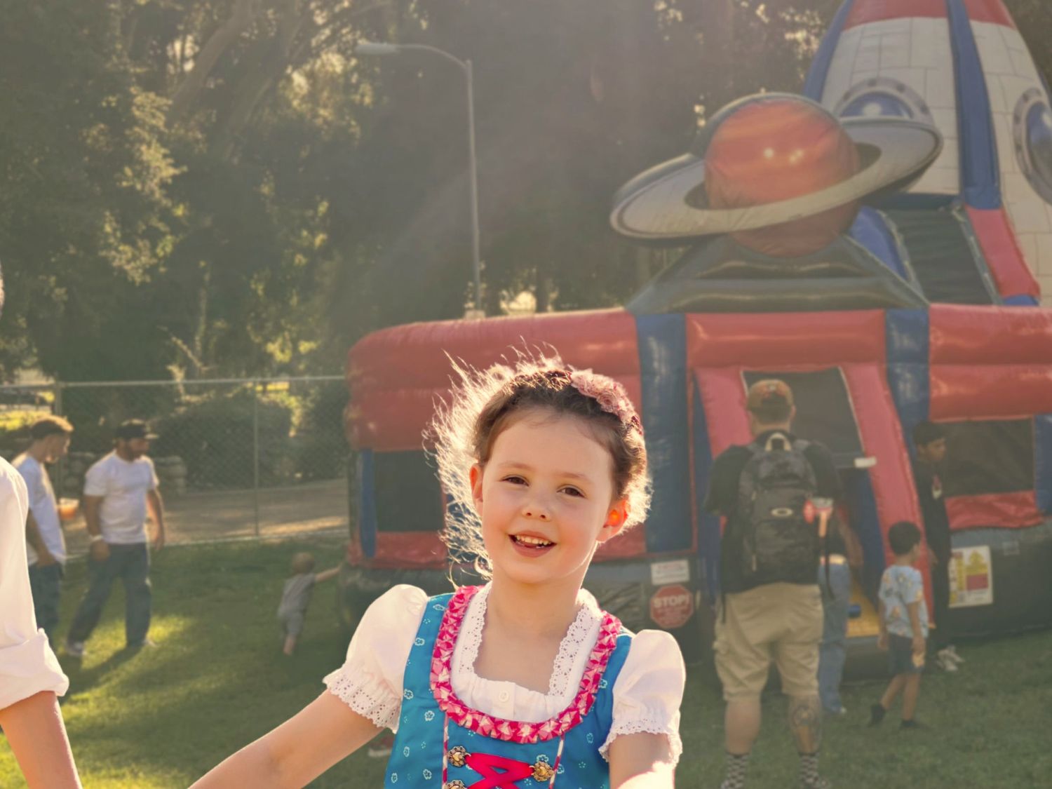 Kids at a park with bounce houses