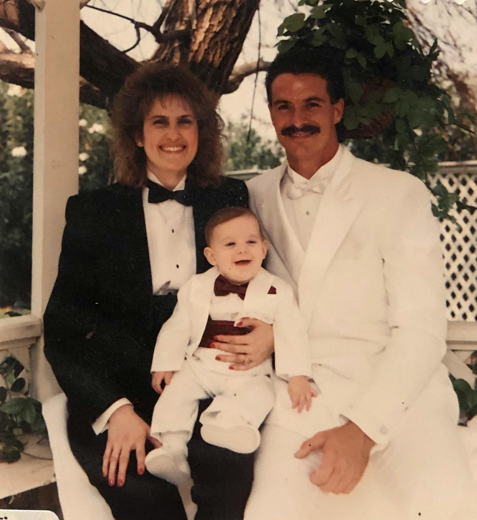 Deborah, David, and son (Jordan) all in tux's at a bridal fair at Edwards Mansion.