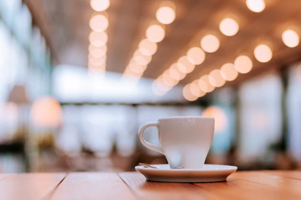 a coffee cup in an warm space with lots of light