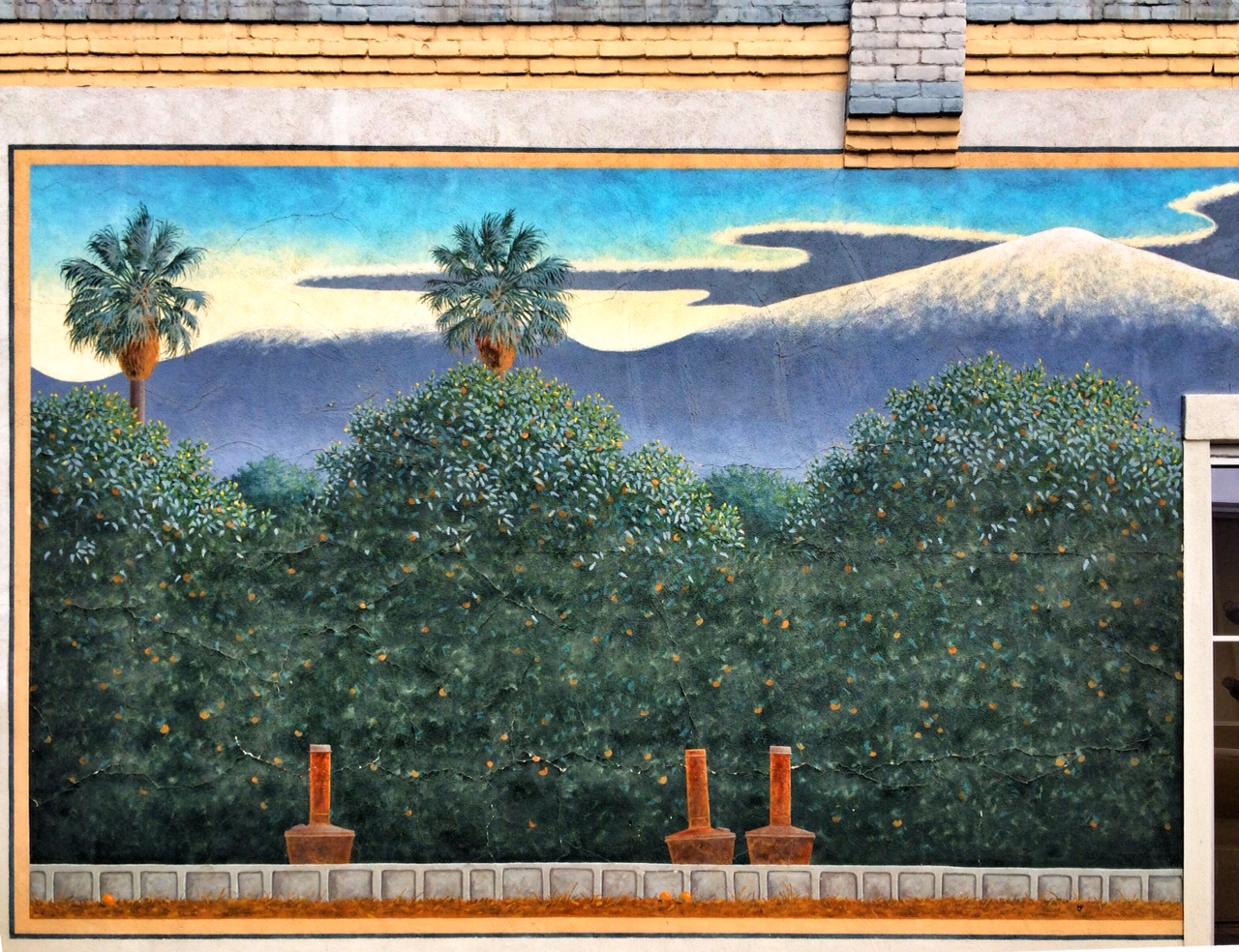 Snowy Mountain View and Smudge Pots in Orange Grove