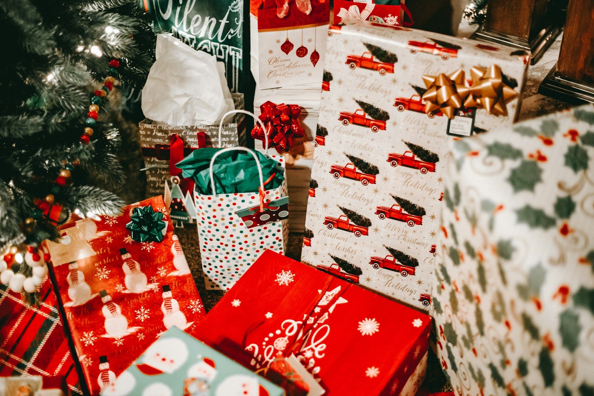 Christmas gifts wrapped under a tree