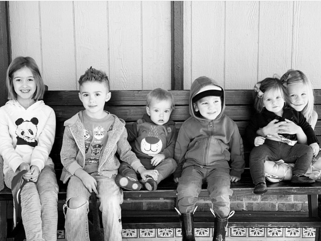 Kids sitting on a bench