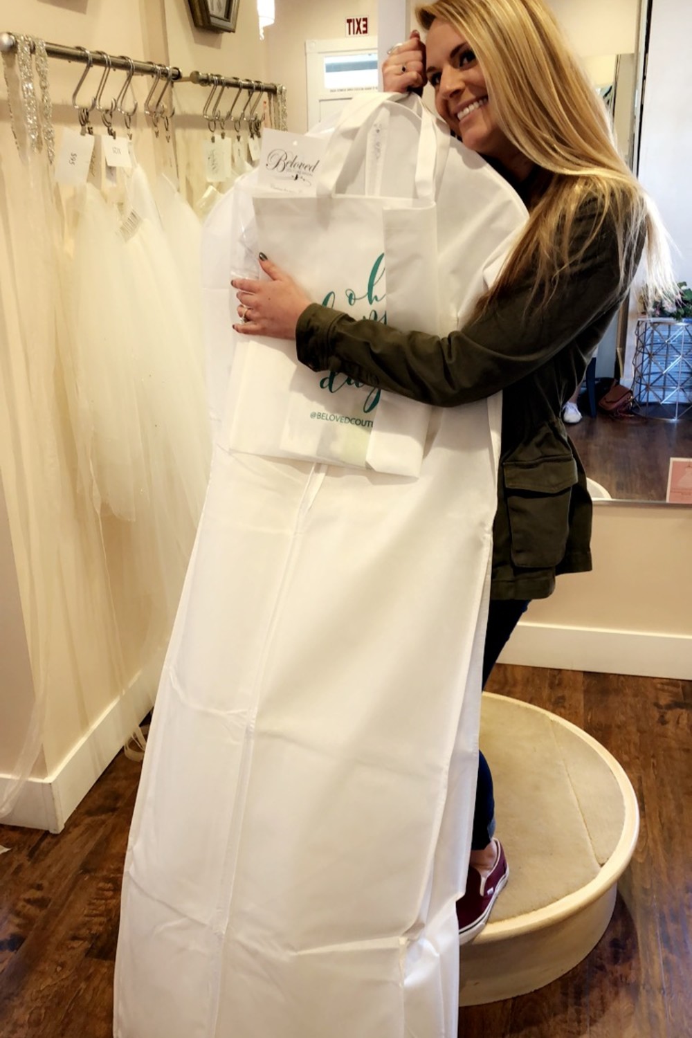 hugging a wedding dress