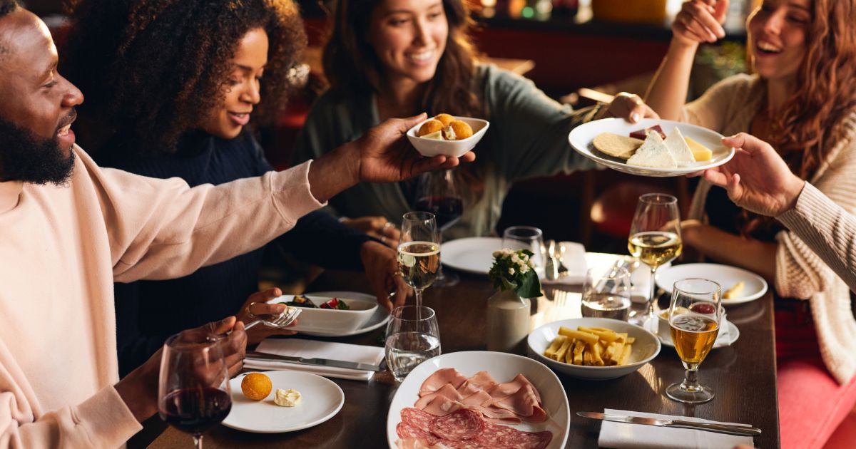 people dining together and toasting